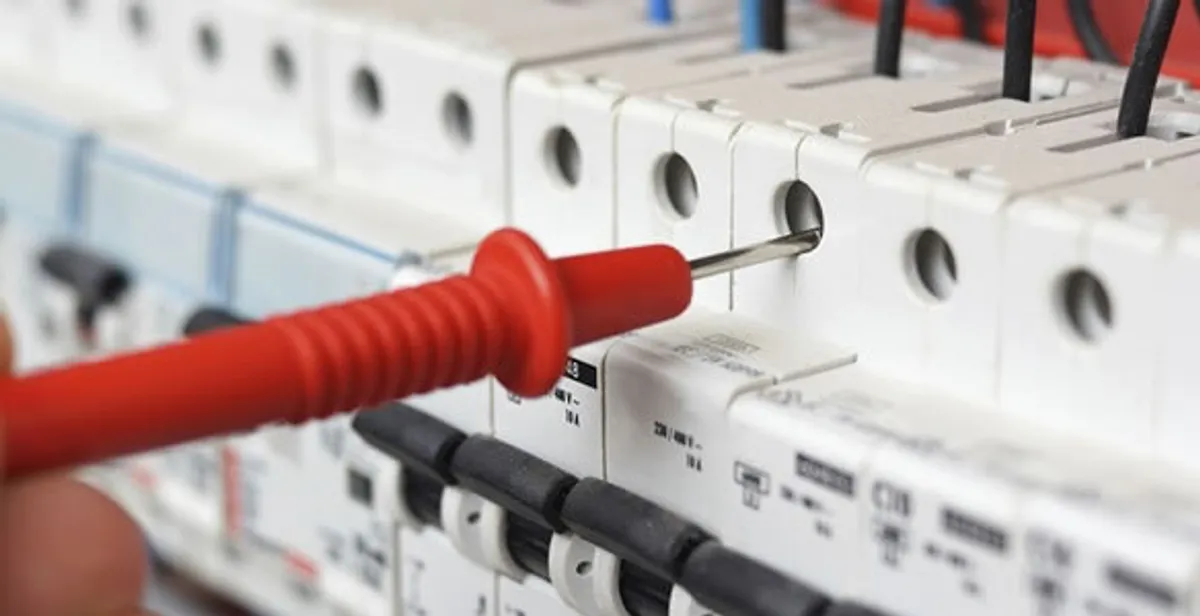 Electrical contractor testing circuit breakers during electrical repair in Parkville, MD