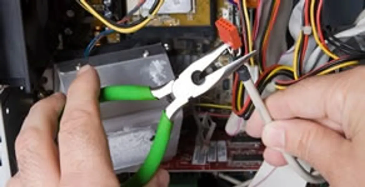 Licensed electrical contractor performing electrical repair with tools in Curtis Bay, MD