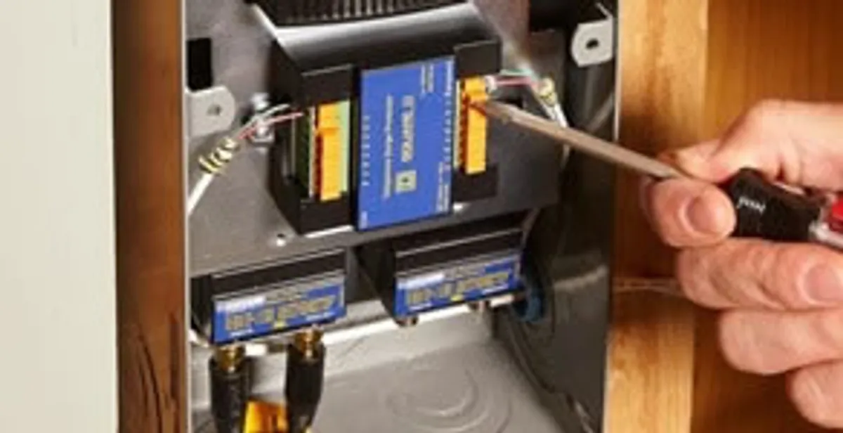 Whole home surge protection device being installed by a licensed electrician to protect electrical systems in Baltimore, MD